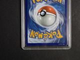 a pokemon card with a poke ball on it