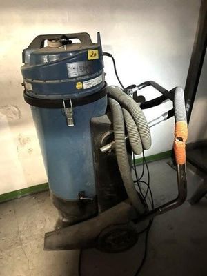 a dust collector and a vacuum in a garage