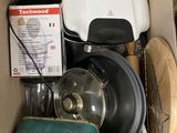 a cardboard box filled with many different types of items