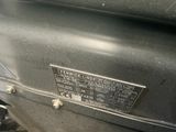 a close up of a motorcycle with a number plate on it