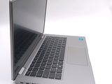 a laptop that is sitting on a white surface