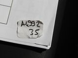 a close up of a piece of paper with a sticker on it