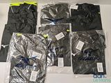 six shirts in plastic bags sitting on a table