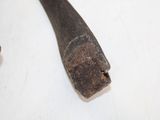 a hammer and a penny sitting on a table