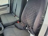 a seat cover that is on the back of a van