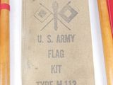 two wooden crochet hooks and a bag with a us army flag on it