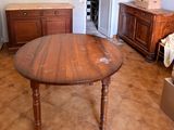 a wooden table in the middle of a living room