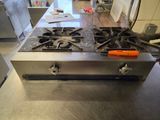 stainless steel counter top in a commercial kitchen with a stove