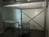 an image of a room with a table and a ceiling fan
