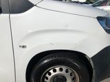 a picture of a white van parked in a parking lot