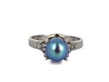 an image of a blue pearl and diamond ring on a white background