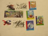 a lot of stamps that are on the table