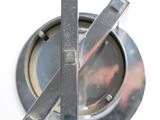 a close up of a metal object with a ball on it