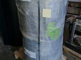 a large bag of plastic wrapped up in a warehouse