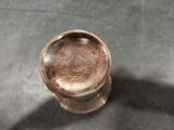 a close up of a metal object on a table