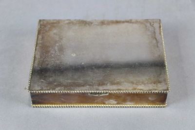 silver plated jewelry box with a glass lid and beading around the edges