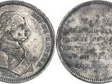 a close up of a coin with a picture of a woman on it