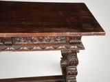 an old wooden table with a carved top on a white background