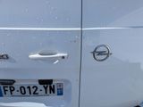 a close up of a white van with a door handle