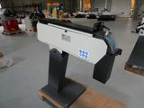 an image of a machine in a factory with other machines
