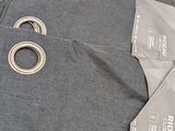 a pair of scissors and a pair of pants laying on a table