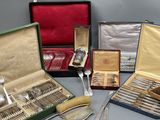 many different types of silverware in a case