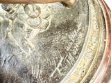 a close up of a metal object on a white surface