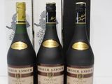 three bottles of wine sitting next to each other on a table