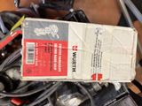 a box that is sitting on top of a pile of tools