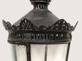 a black lamp with a crown on top of it