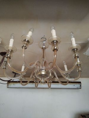 a chandelier hanging from the ceiling in a room
