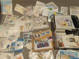 a suitcase full of stamps and postcards on a table