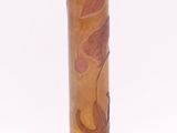 a glass vase with a brown base on a white background