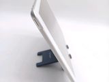 a white tablet computer sitting on top of a table