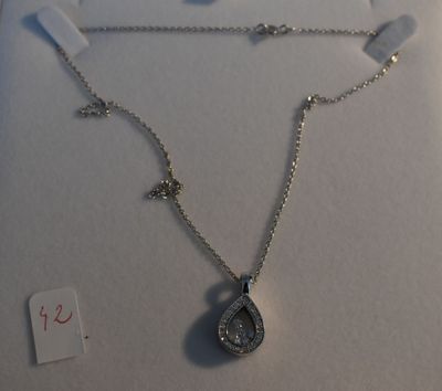 silver plated necklace with a tear shaped pendant and a cross on a chain