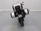 a black and white motorcycle with a license plate on it