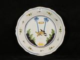 a plate with a bird on it on a black background