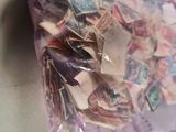 a bag full of stamps on a counter top