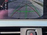 a car dashboard with a rear view mirror and a camera attached to it