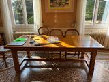 a wooden table with a book on it in a room