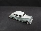a toy car that is sitting on a black surface