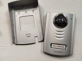 a camera and a cell phone sitting on a table