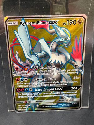 a pokemon card on display in a glass case