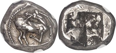 an ancient coin with a picture of a man on a horse