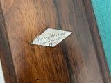 a close up of a piece of wood with a label on it