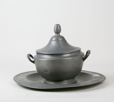 silver plate with saucer and saucer on it on a white surface