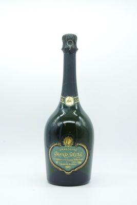 an image of a bottle of wine sitting on top of a table