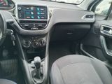 the interior of a car with a steering wheel and dashboard controls