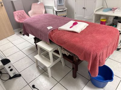 a room with a bed and a chair in it