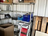 many boxes and boxes on the shelves in the garage